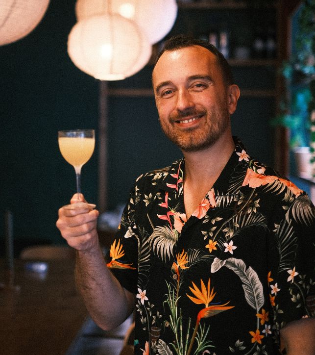 a man holding a drink