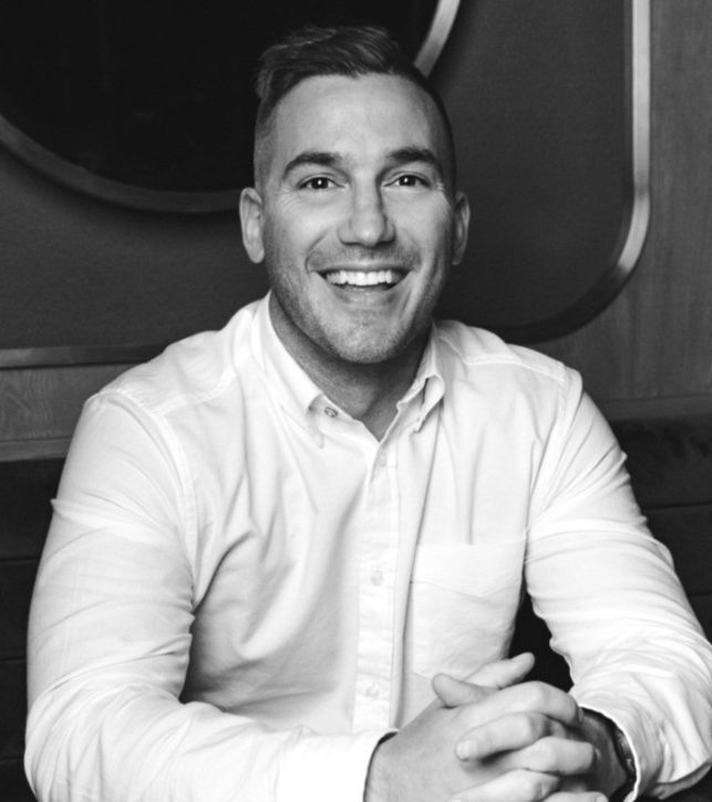 a man smiling at camera