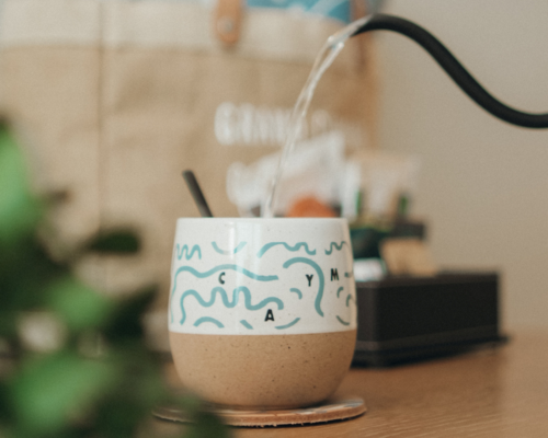 a water pouring into a cup