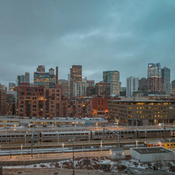 a city with a train in the distance