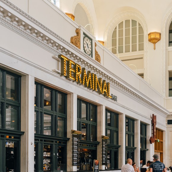 a building with people sitting in front of it
