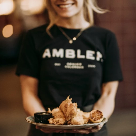 a woman holding a plate of food