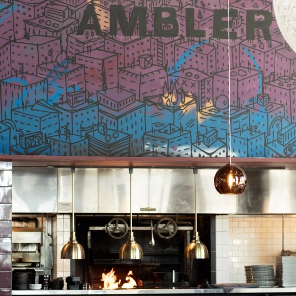 a kitchen with a fire and a sign