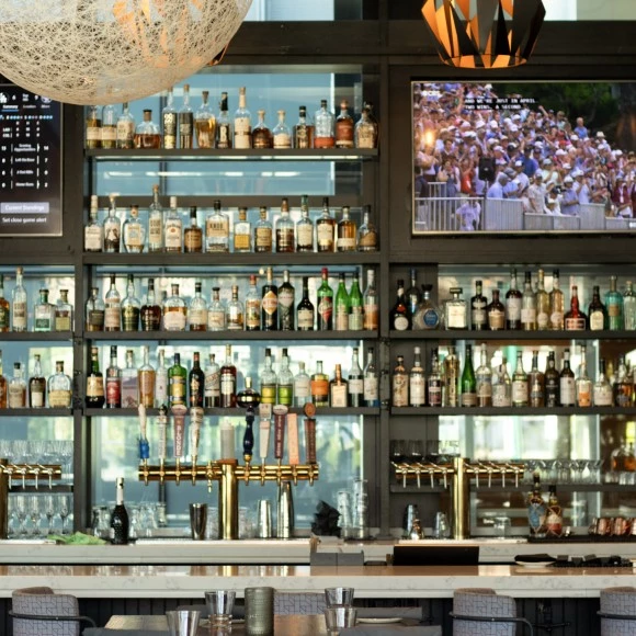 a bar with bottles of alcohol