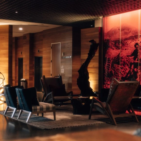 a room with chairs and a statue