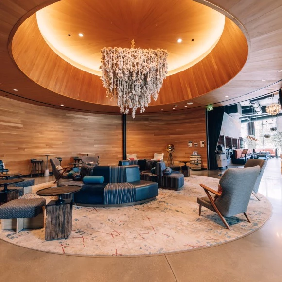 a room with a chandelier and chairs