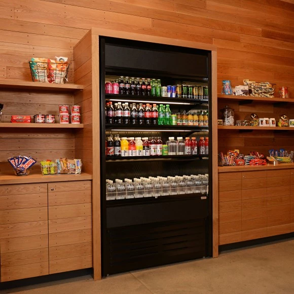 a shelf with drinks and snacks on it