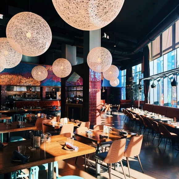 a restaurant with tables and chairs