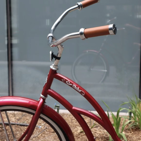 a red bicycle with a handlebar