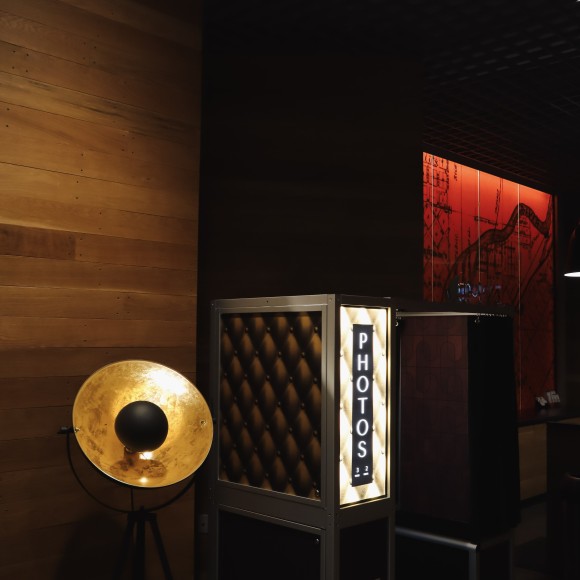 a room with a lamp and a booth