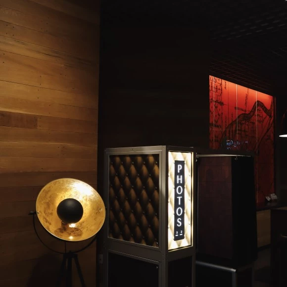 a room with a lamp and a booth