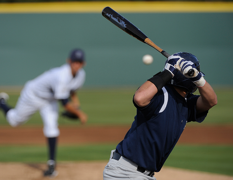 a baseball player swinging a bat