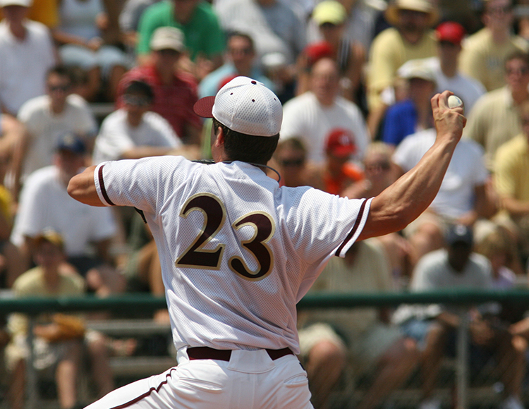 a baseball player throwing a ball