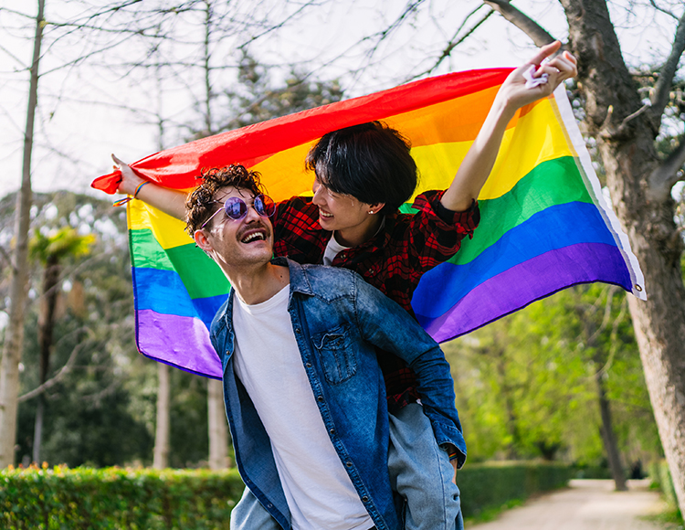 a man carrying a woman on his back
