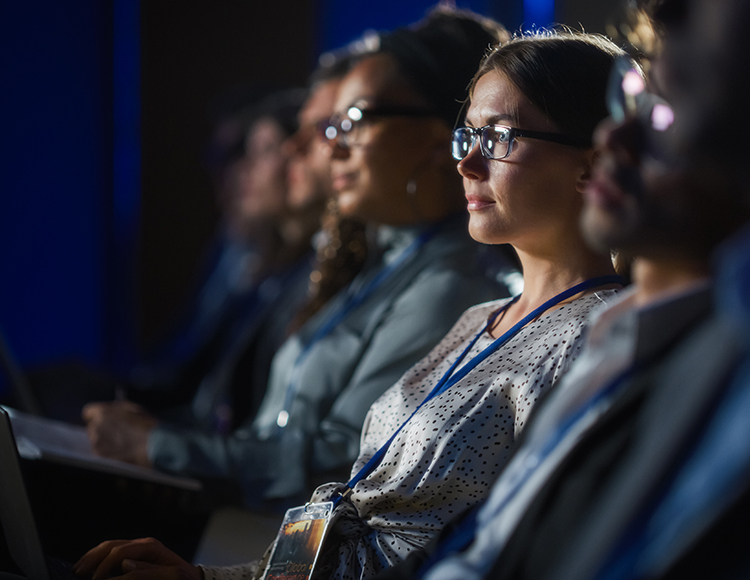 a group of people sitting in a row