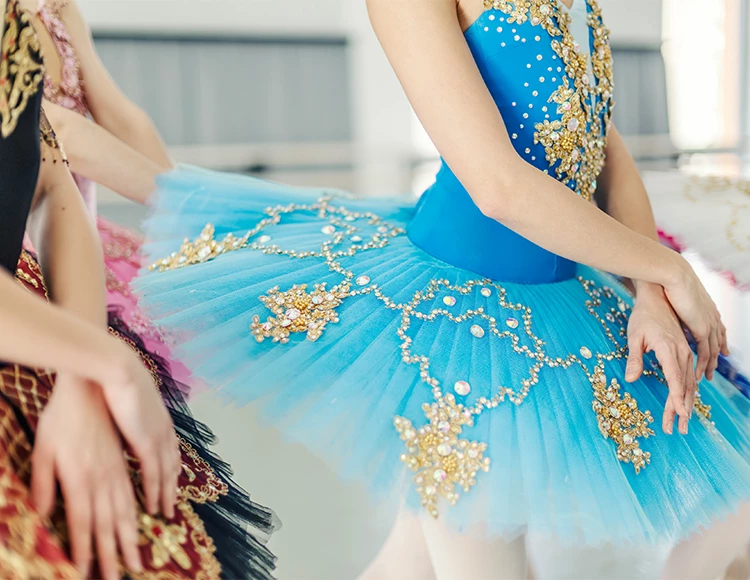 a group of women in ballet clothing