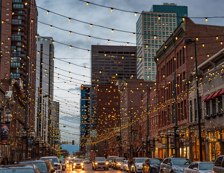 a city street with cars and lights
