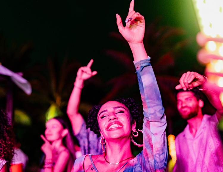 a group of people dancing at night
