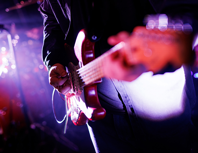 a person playing a guitar