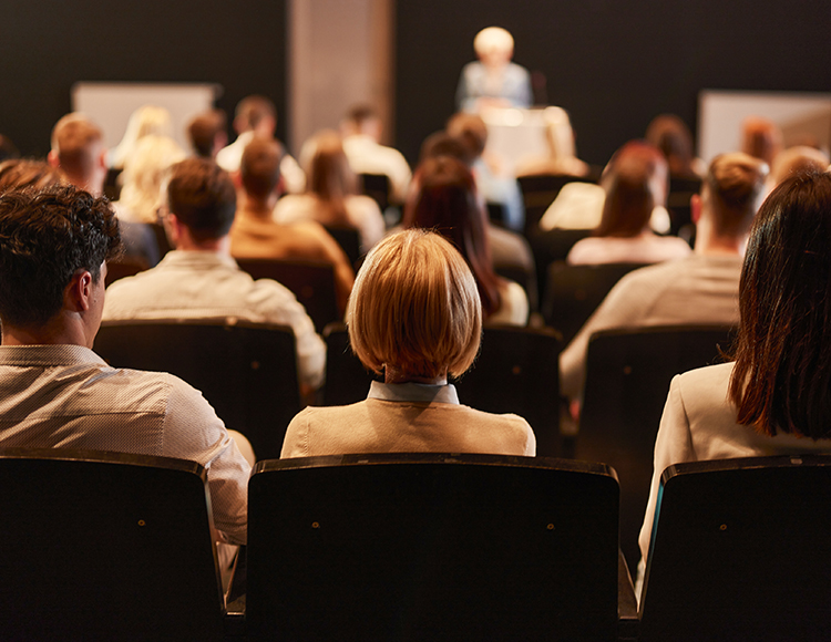 a group of people sitting in chairs