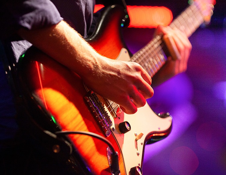 a person playing a guitar