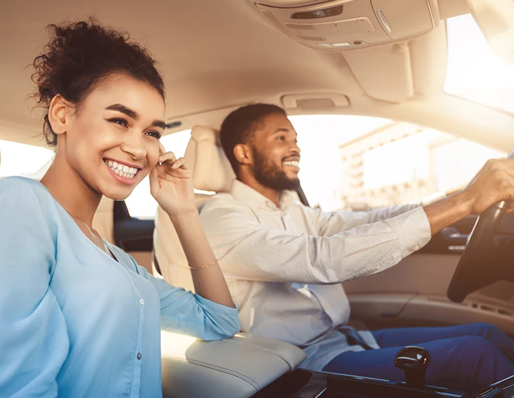couple taking a drive on a sunny day
