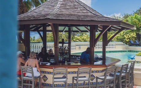 a pool bar with people sitting around it