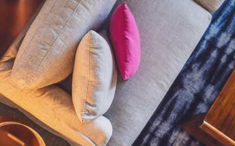 a group of pillows on a couch