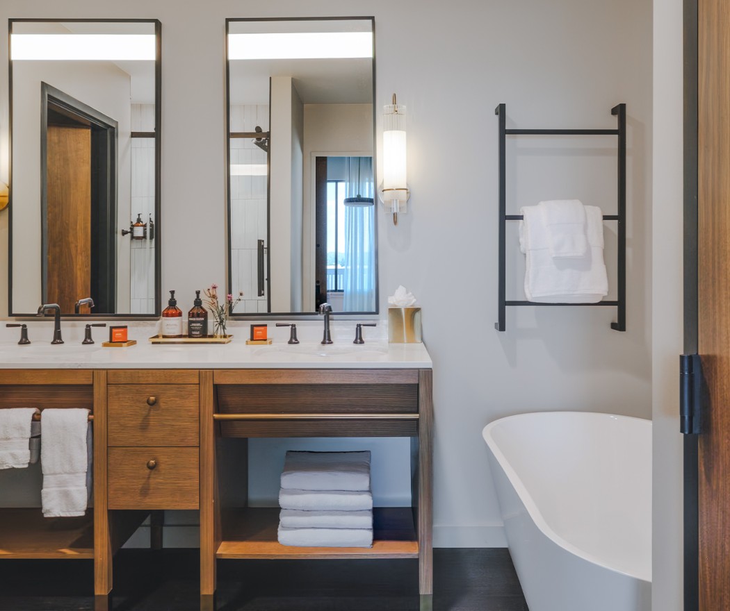 a bathroom with a tub and a sink