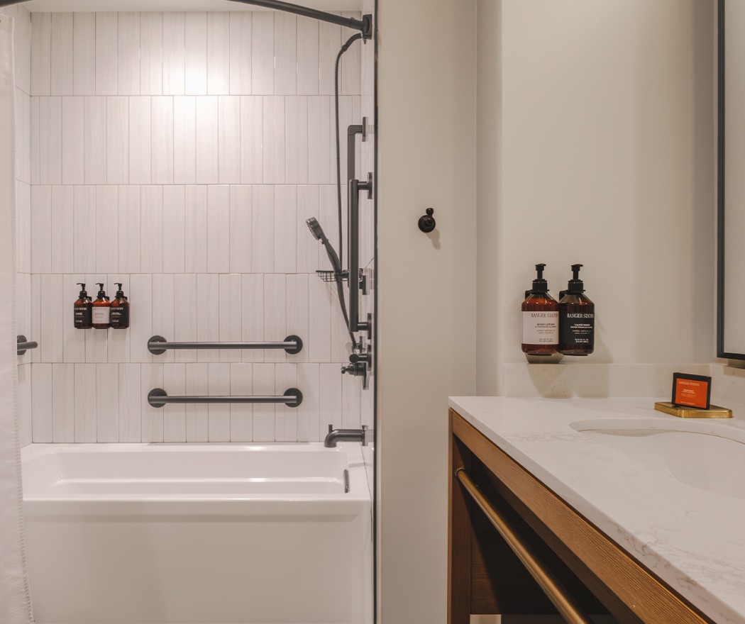 a bathroom with a bathtub and a shower