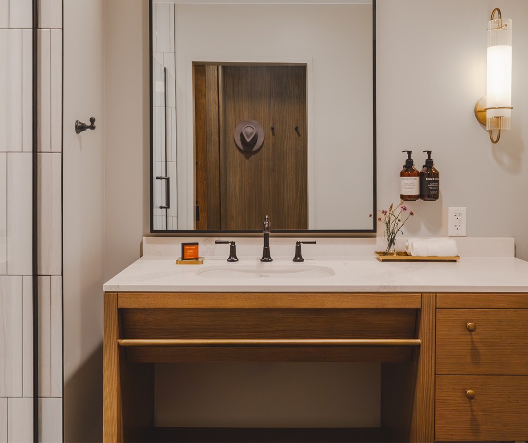a bathroom with a mirror and sink