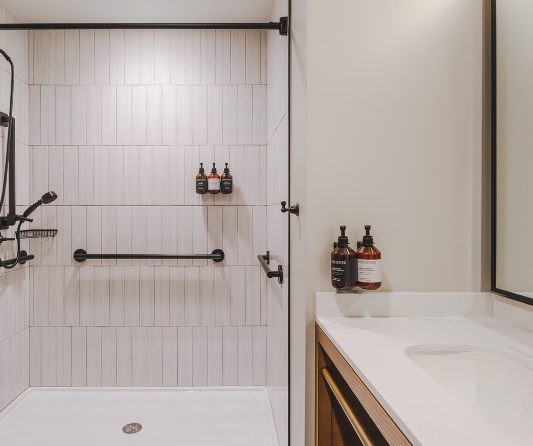 a bathroom with a shower and a sink