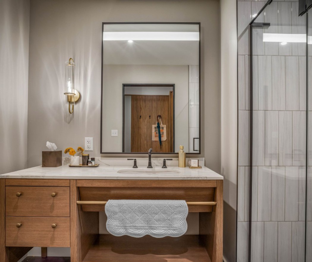 a bathroom with a mirror and sink
