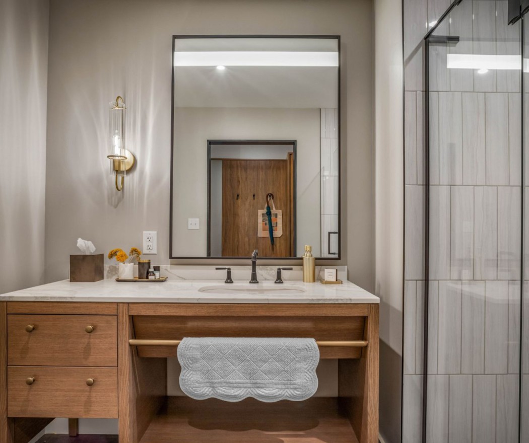 a bathroom with a mirror and sink