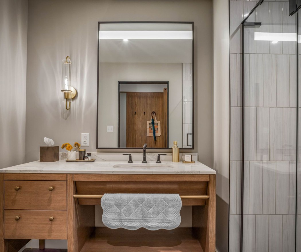 a bathroom with a mirror and a sink