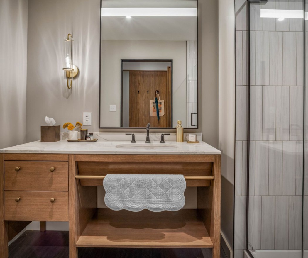 a bathroom with a mirror and sink