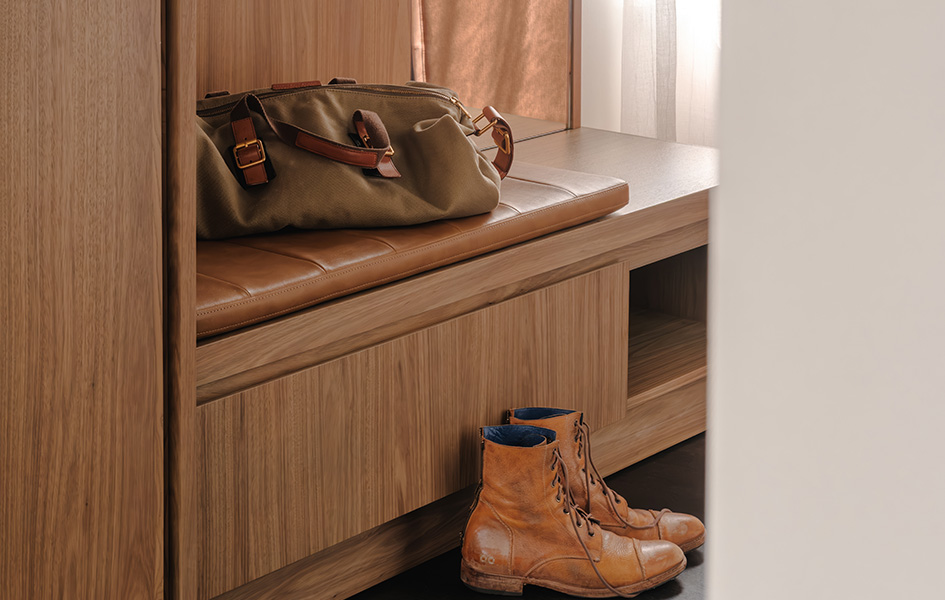 a bag and boots on a bench
