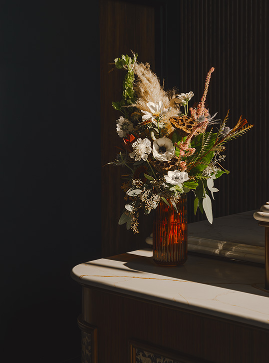 a vase of flowers on a table