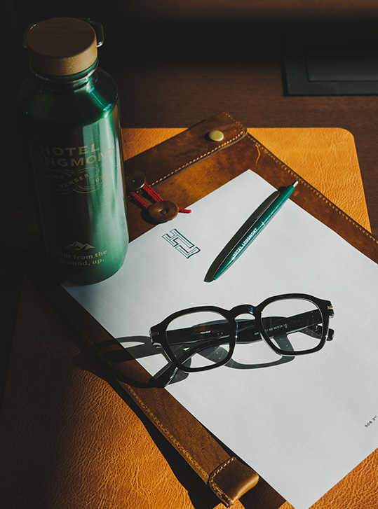 a pen and glasses on a piece of paper