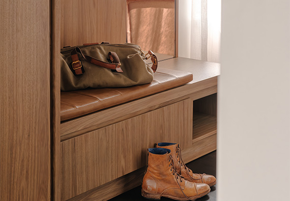 a bag and boots on a bench