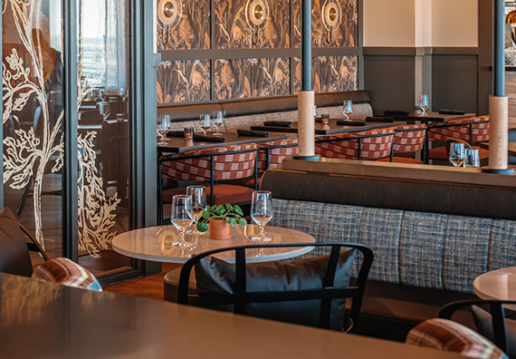 a restaurant with tables and chairs