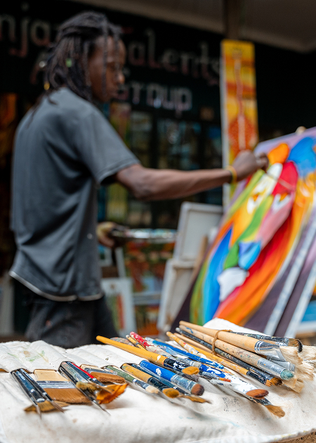 a man painting a picture
