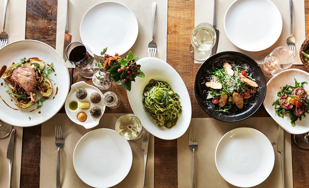 a table with plates and plates and food on it