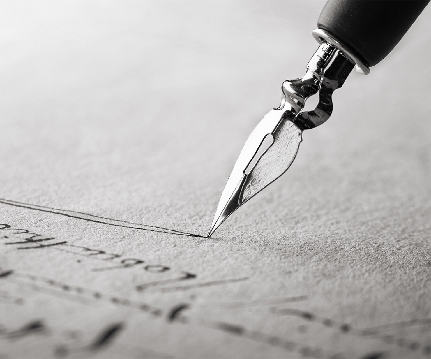 close-up of a fountain pen writing on a piece of paper