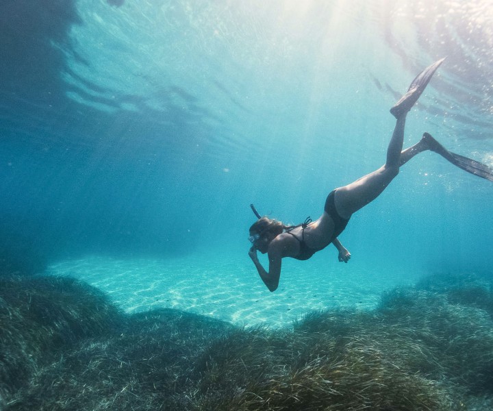 a woman in a garment underwater