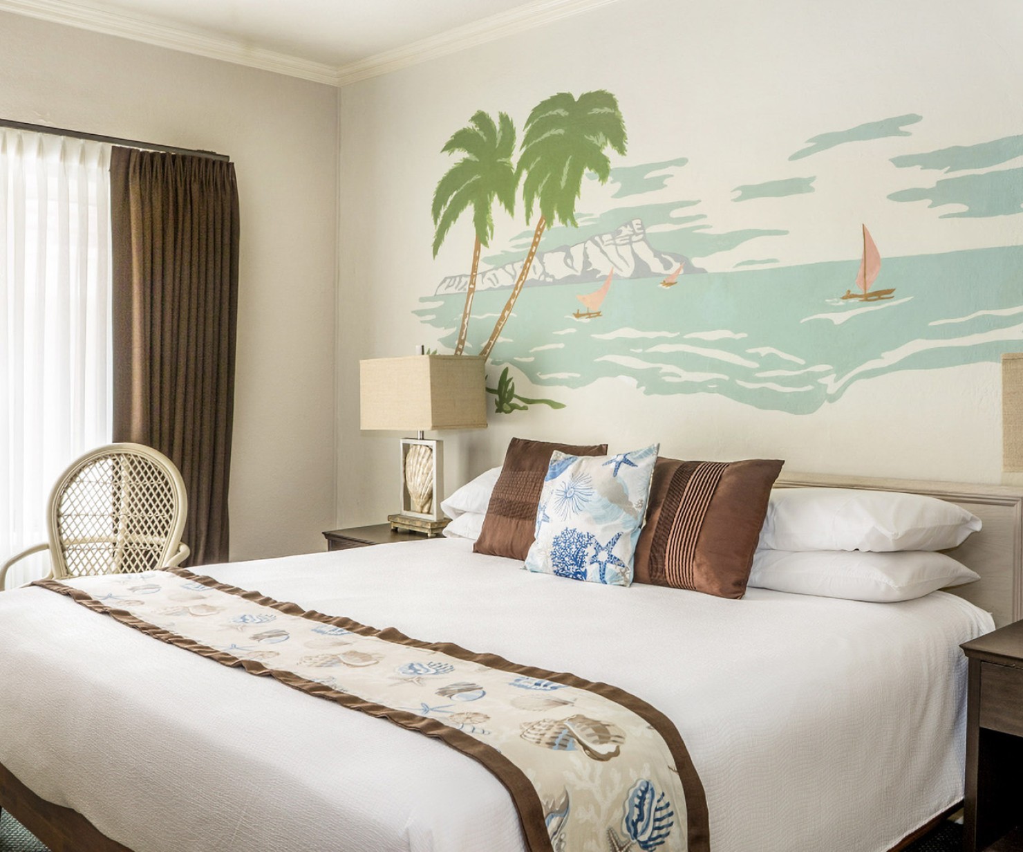 a bed with a painting on the wall