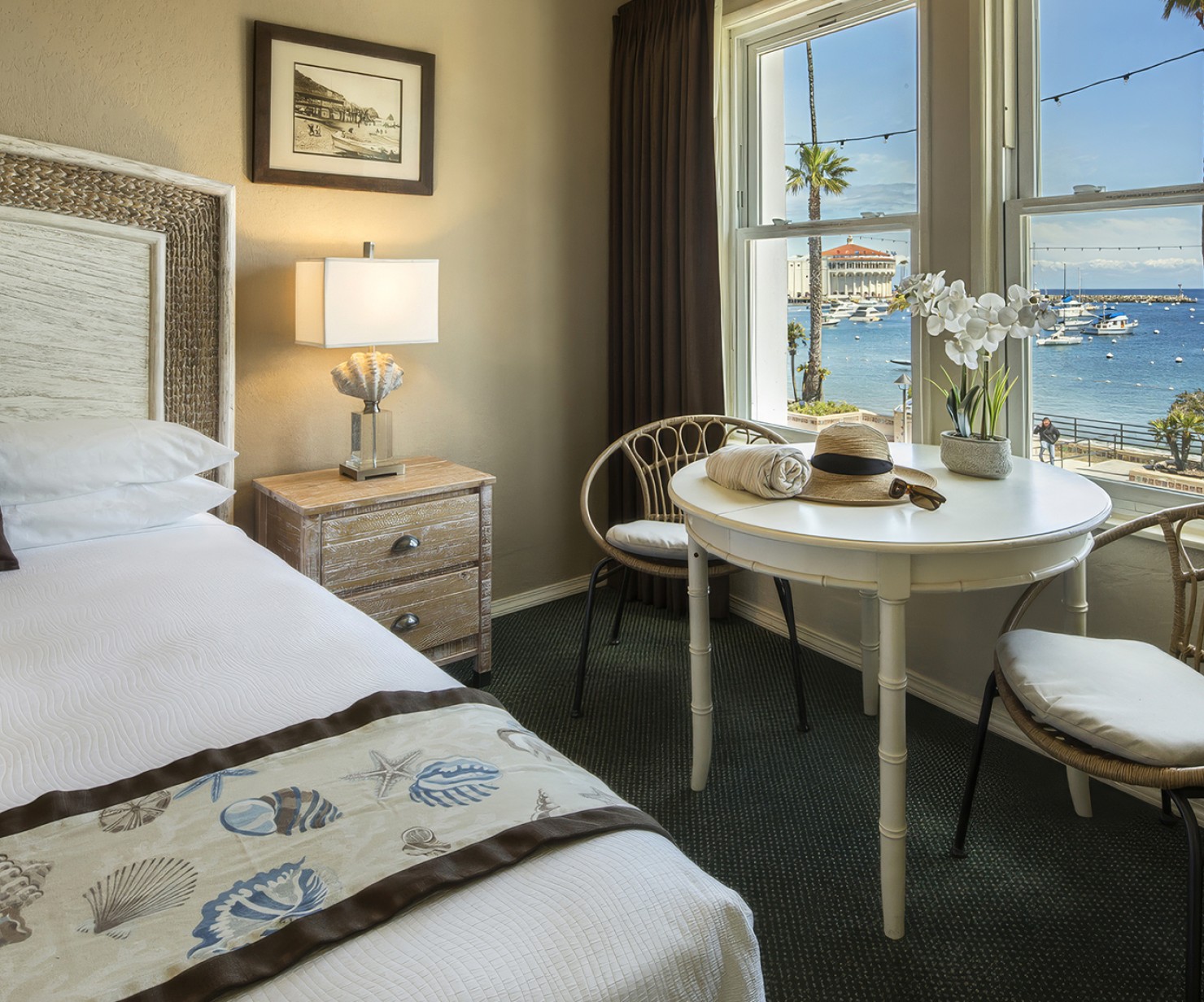 a room with a bed and a table and chairs