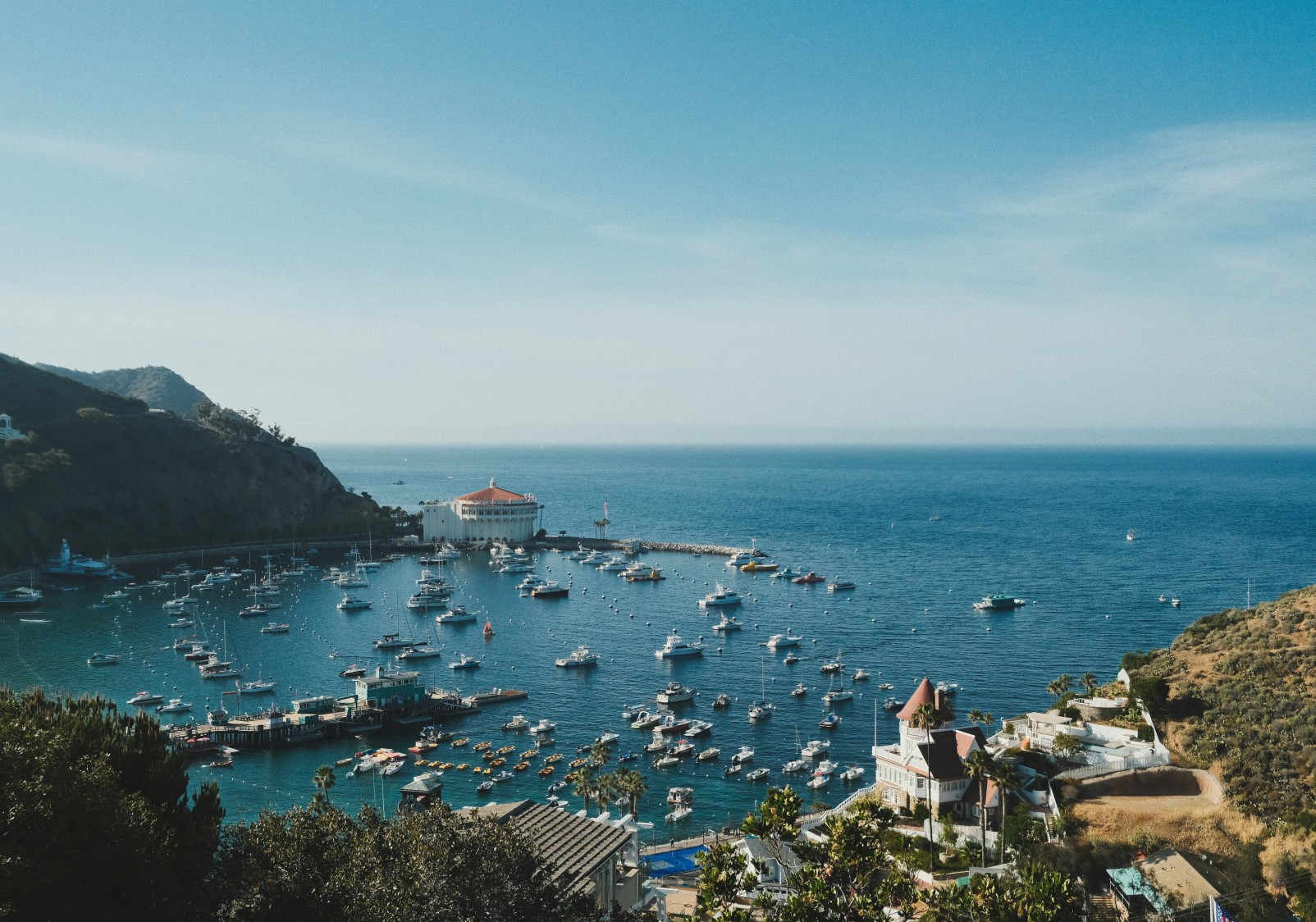 a harbor with boats and buildings in the background
