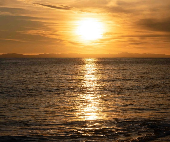 a sunset over a body of water