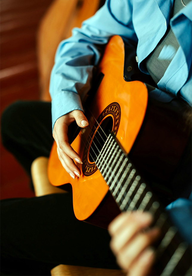 a person playing a guitar